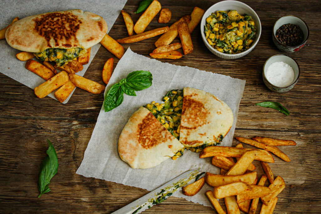 Vegetarian spinach and corn pita with melted cheese