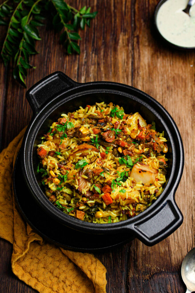 Easy vegetable biryani with potatoes, carrots, green beans and fried onions