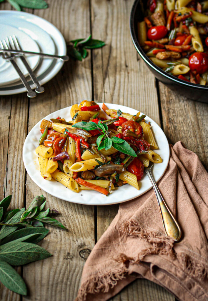 Penne primavera with blistered balsamic tomatoes and fresh basil