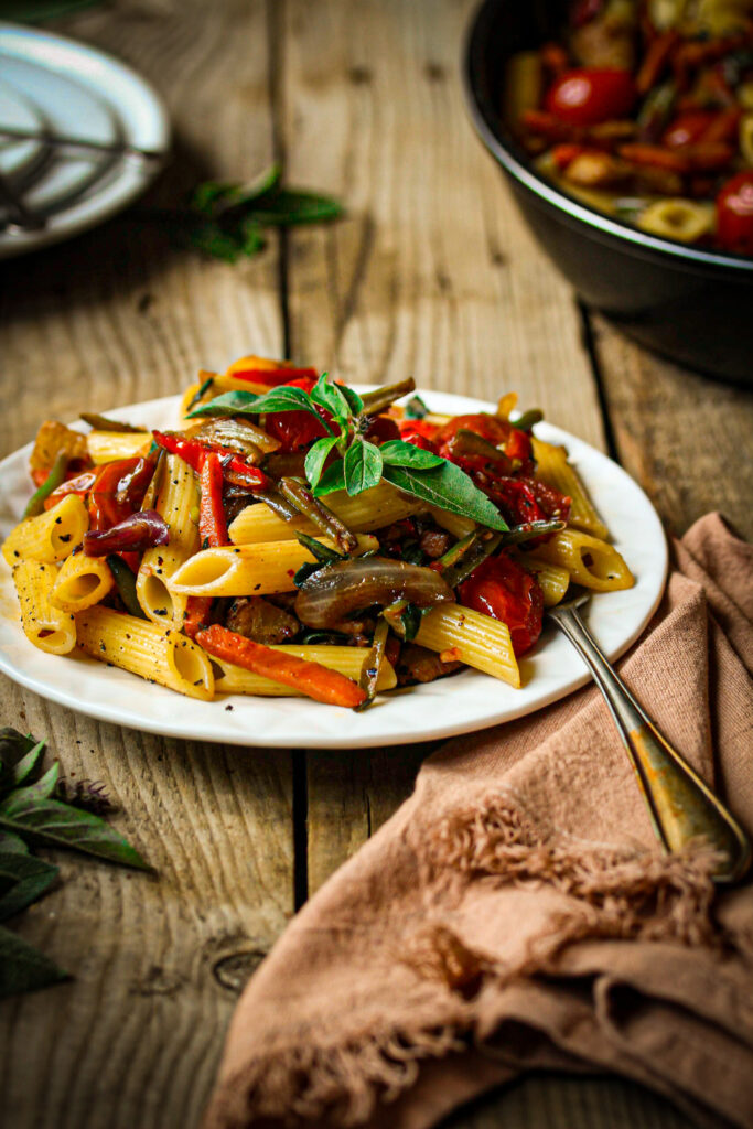 Penne primavera with fresh vegetables and balsamic tomatoes