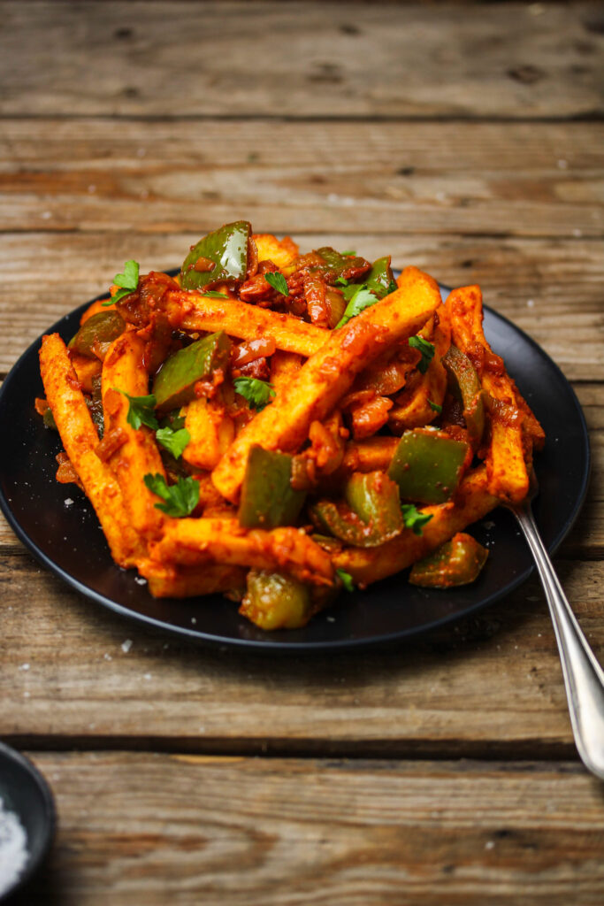 Spicy masala chips coated in onion and green pepper sauce