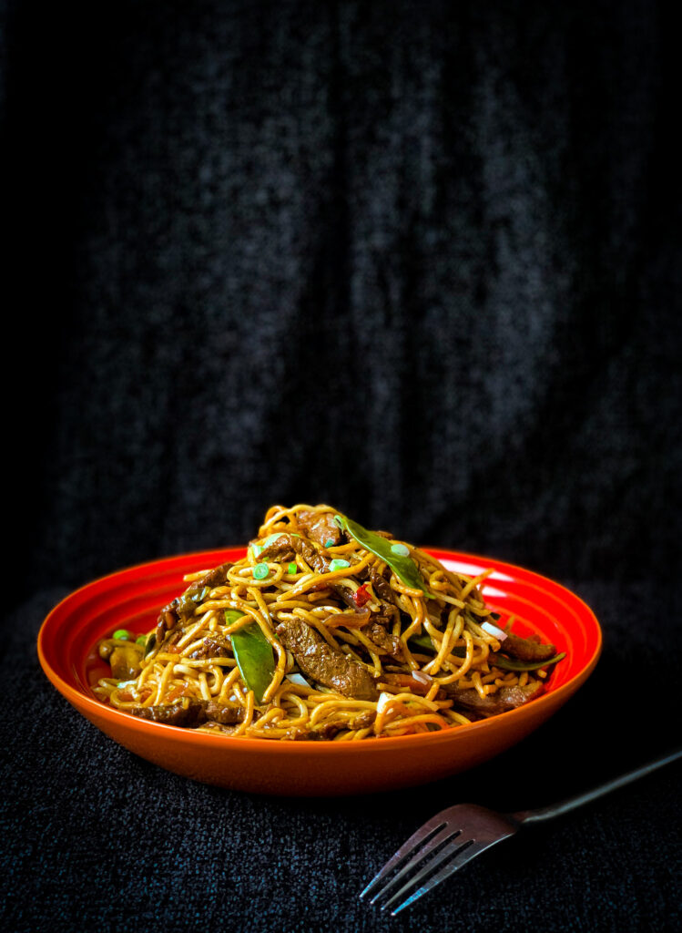 Easy homemade chow mein with egg noodles, meat and mixed vegetables