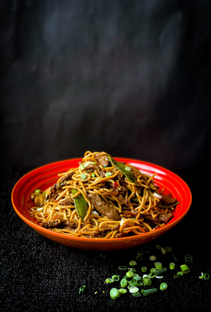 Easy chow mein noodles with meat, vegetables and spring onions