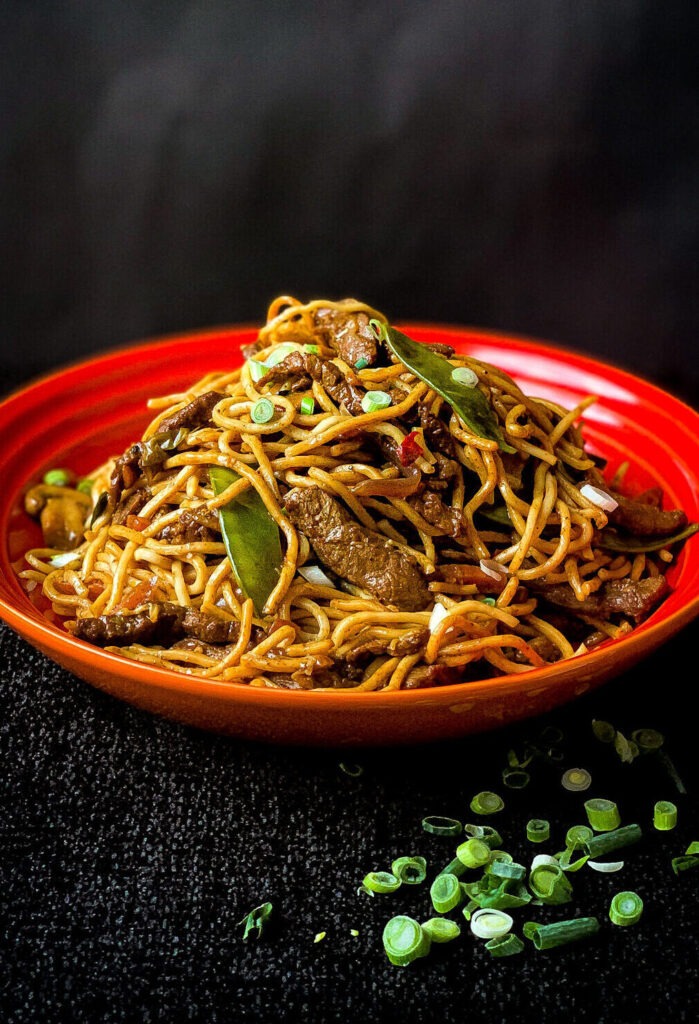 Easy chow mein noodles with meat, vegetables and spring onions